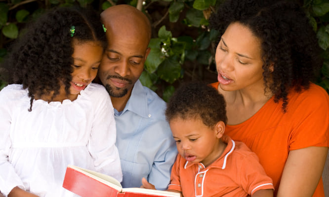 photo of a family reading together